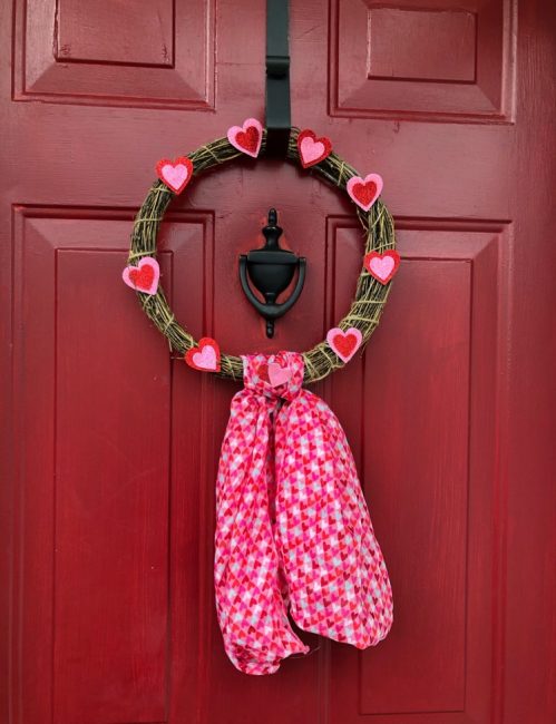 Make an adorable Valentine's Day wreath with only about $3 in supplies from the dollar store.