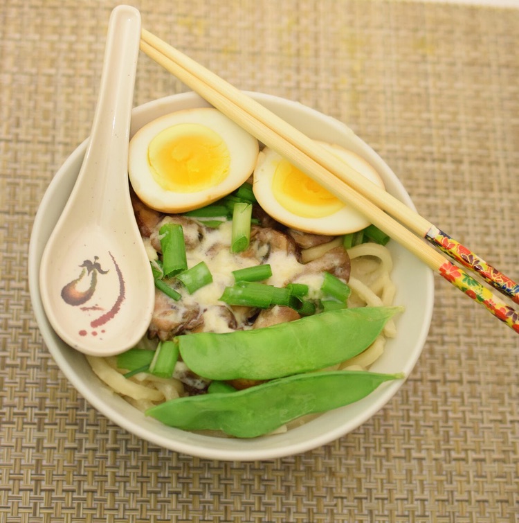 I love this easy recipe for mushroom udon noodle soup topped with a cheesy sauce and a soy egg.