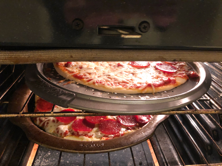 Baking homemade pizzas in the oven at home