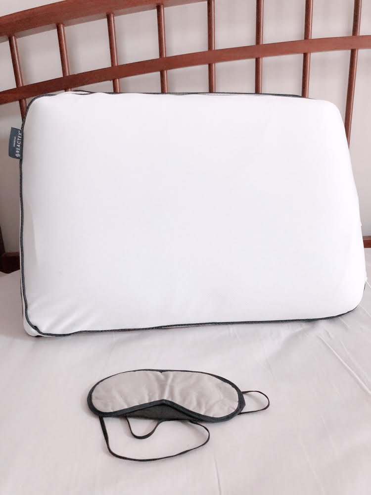 A farmhouse style bed, cooling memory foam pillow and night mask.