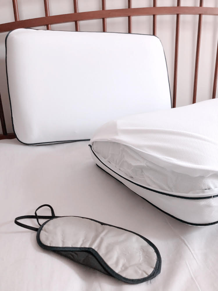 A cooling memory foam pillow with a removable and washable cover, and a night mask.