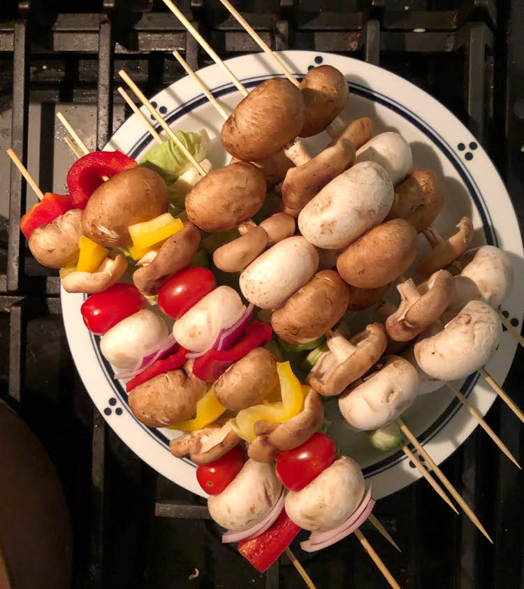 Mushroom, onion and pepper kebabs for cooking over a fire pit or grill.