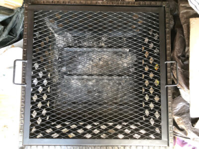 the inside of a metal fire pit by Landmann