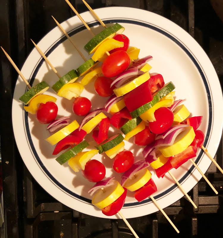 Zucchini, onion and tomato kabobs for a grill or a fire pit.