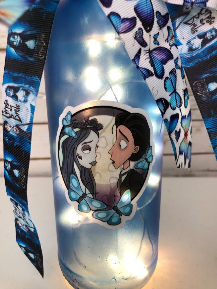 a handcrafted lit Corpse Bride wine bottle (decor) for Halloween