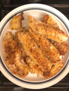 plate of air fryer chicken with a crisp seasoned coating