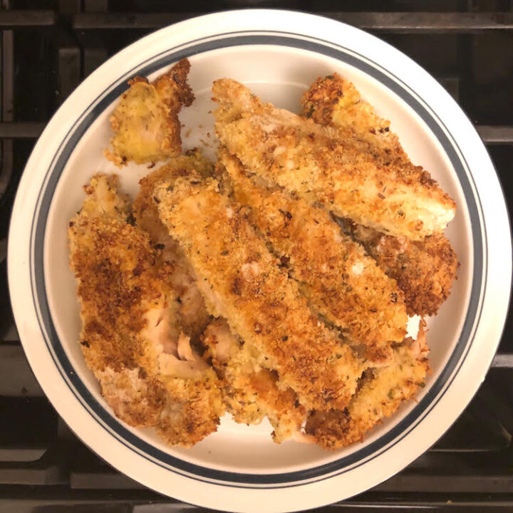 plate of air fryer chicken with a crisp seasoned coating