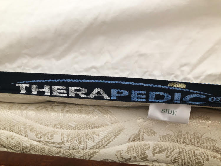 Therapedic sheets with a tag marking the "side" of the sheet