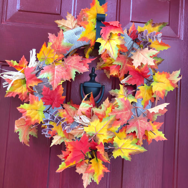 colorful burlap and faux fall wreaths wreath on a red door