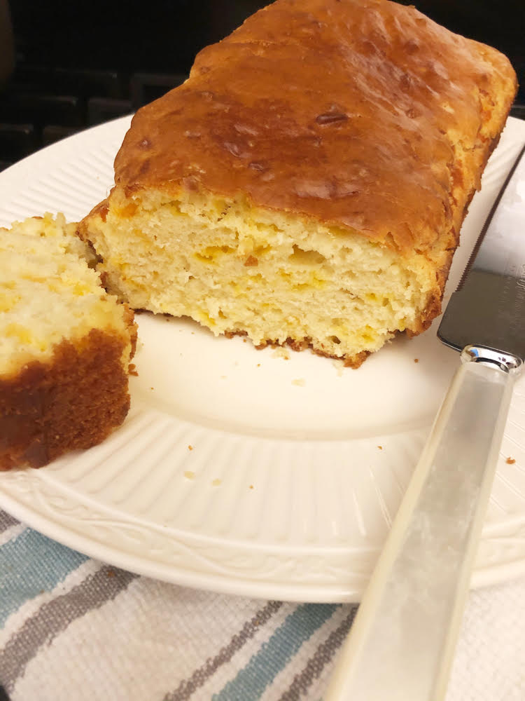 a hearty slice of homemade cheddar and green onion quick bread