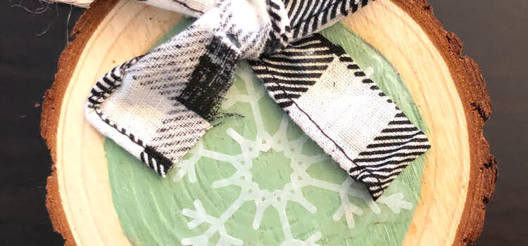 diy snowflake wood slice ornament with a buffalo plaid ribbon