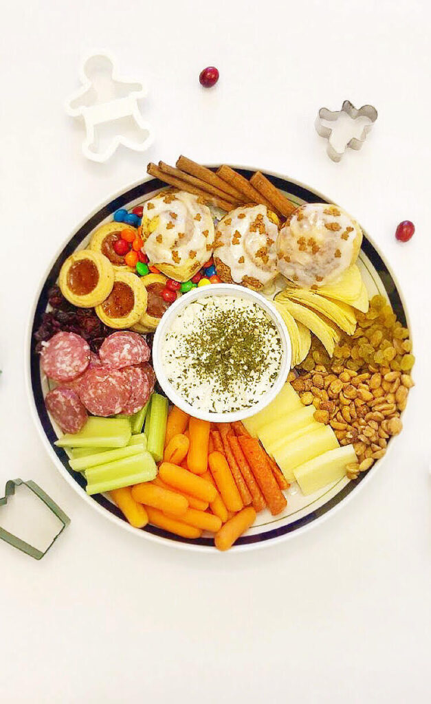 Christmas charcuterie tree with sweets, cheeses, meats and veggies