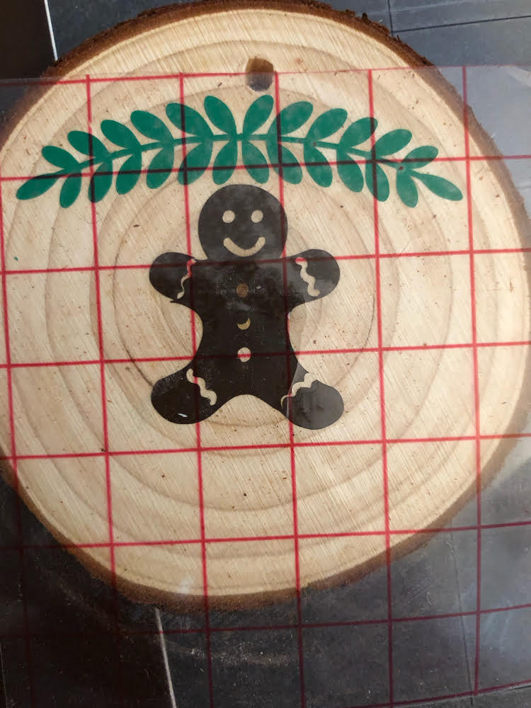 how to transfer a Silhouette cut vinyl design with transfer tape to a wood slice ornament