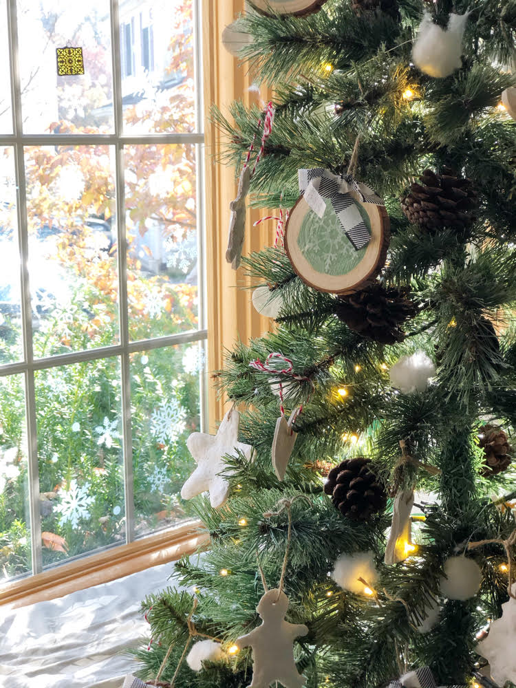 realistic looking artificial Christmas tree from Nearly Natural. The tree is decorated with wood slice ornaments and salt dough ornaments plus a cotton ball garland