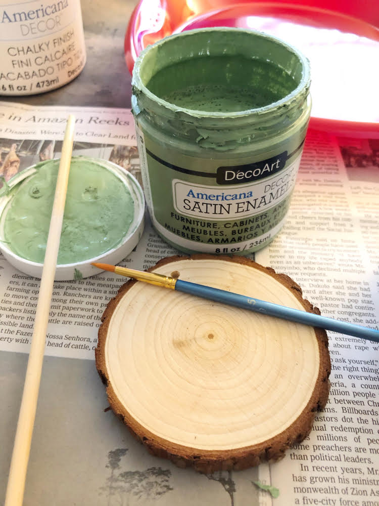 painting a wood slice Christmas ornament