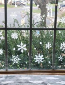 window seat with a window filled with faux snowflake vinyl decals