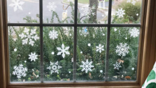 window seat with a window filled with faux snowflake vinyl decals