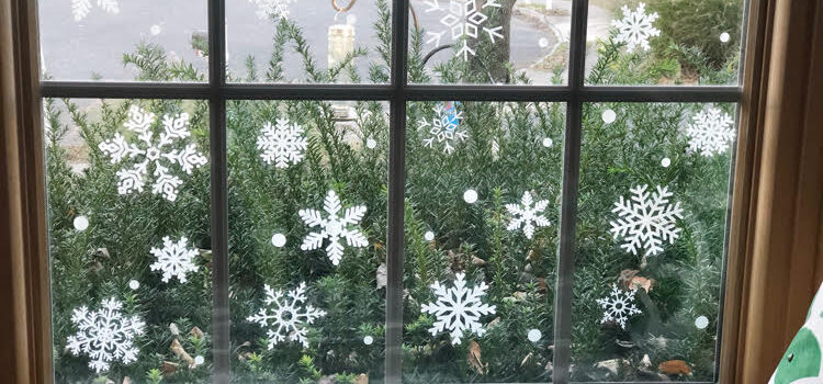 window seat with a window filled with faux snowflake vinyl decals