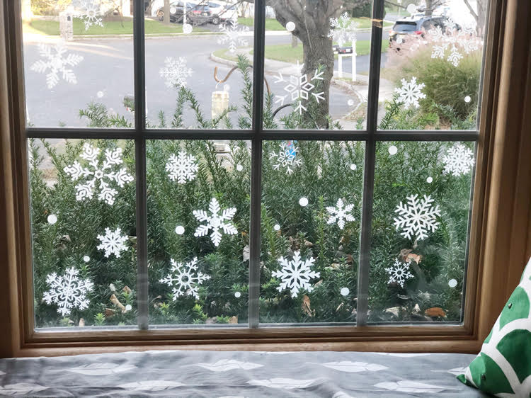 window seat with a window filled with faux snowflake vinyl decals