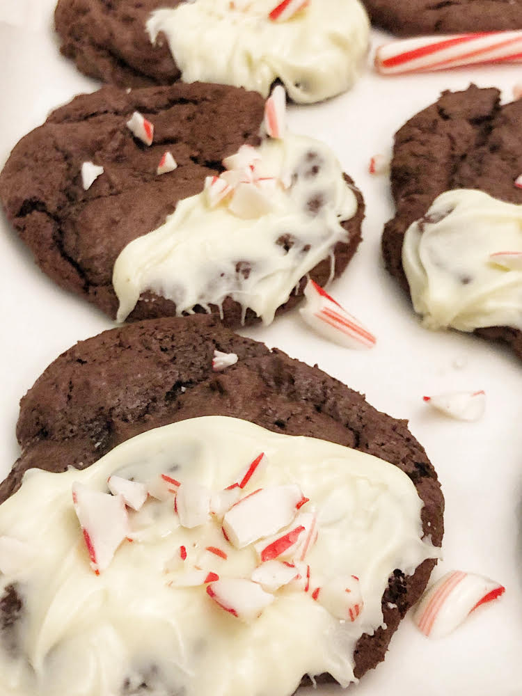 chocolate cookies iced with white chocolate and topped with crushed candy canes