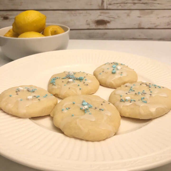 delicious frosted lemon shortbread cookies on a white p[late
