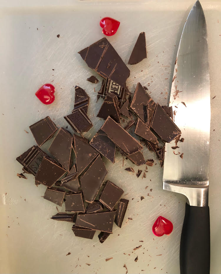 chopped dark chocolate on a cutting board