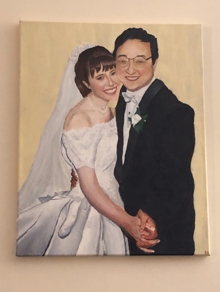 Hand painted wedding portrait of a man and a woman on a wall