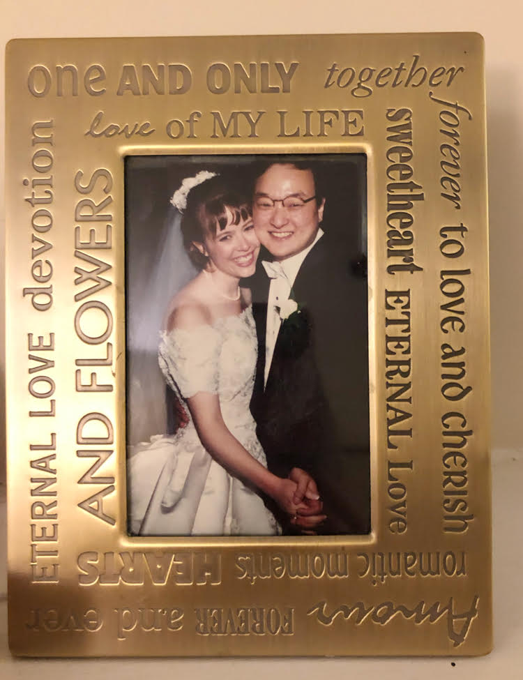 wedding photo framed in engraved gold frame