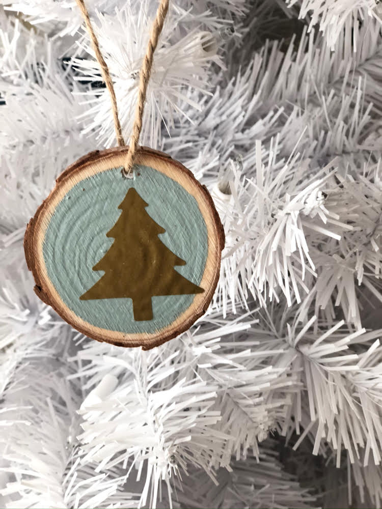 a beautiful gold and blue Christmas wood slice ornament