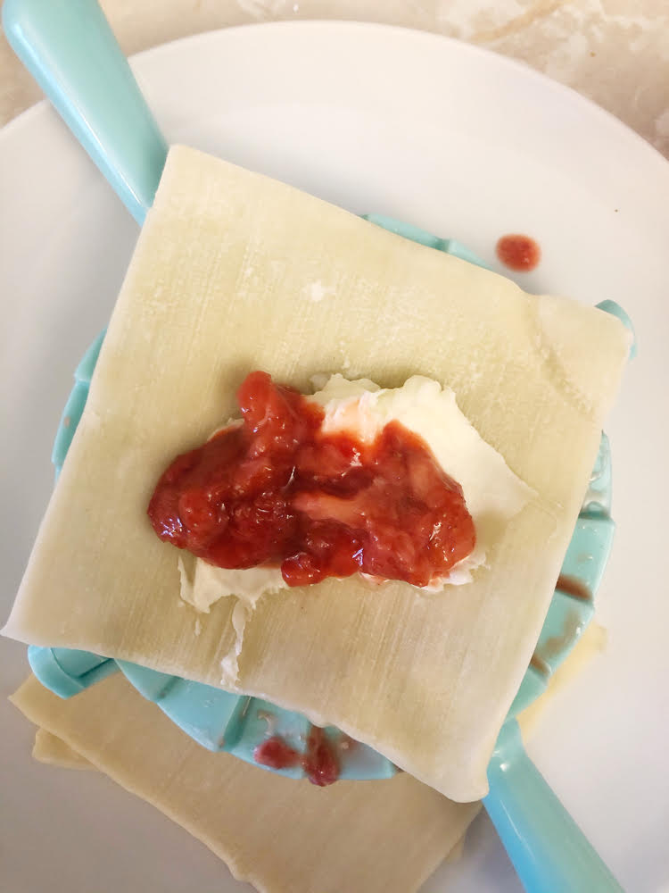 making strawberry cream cheese dessert dumplings with a handy dumpling maker