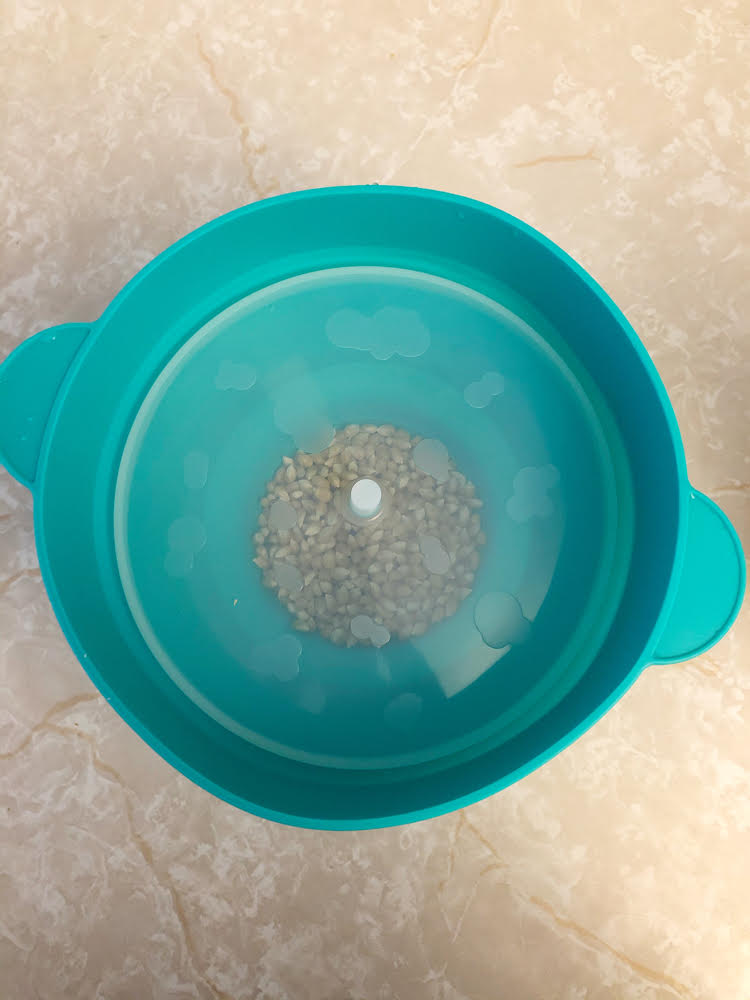 A Silicone popper for the microwave makes it so easy to pop popcorn! I love this aqua blue one.