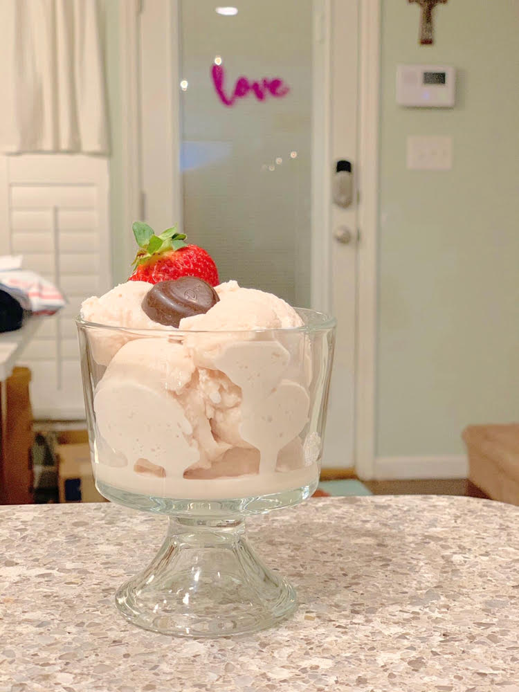 a bowl of small batch homemade strawberry ice cream