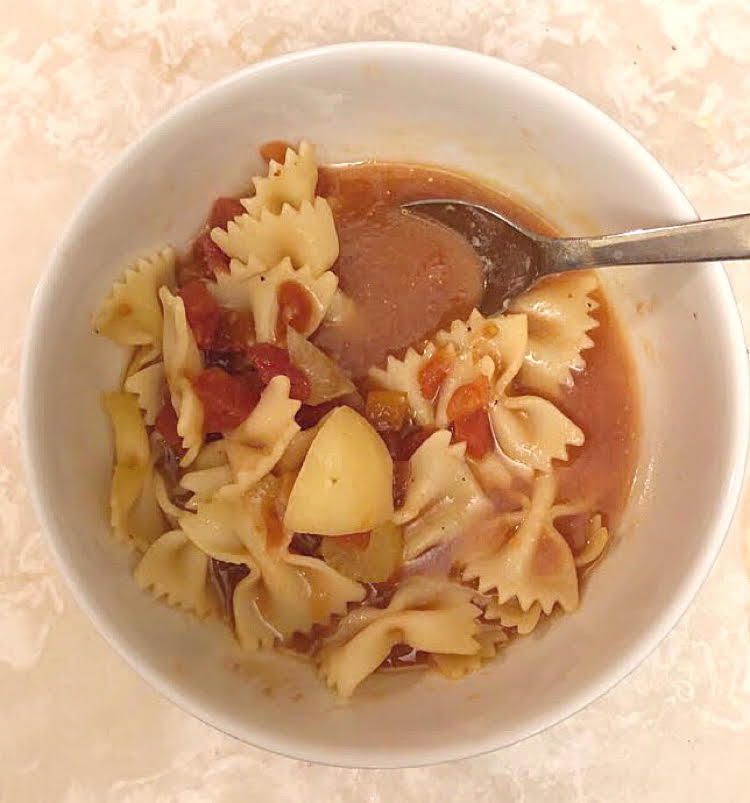 a bowl of homemade tomato and potato vegetable soup