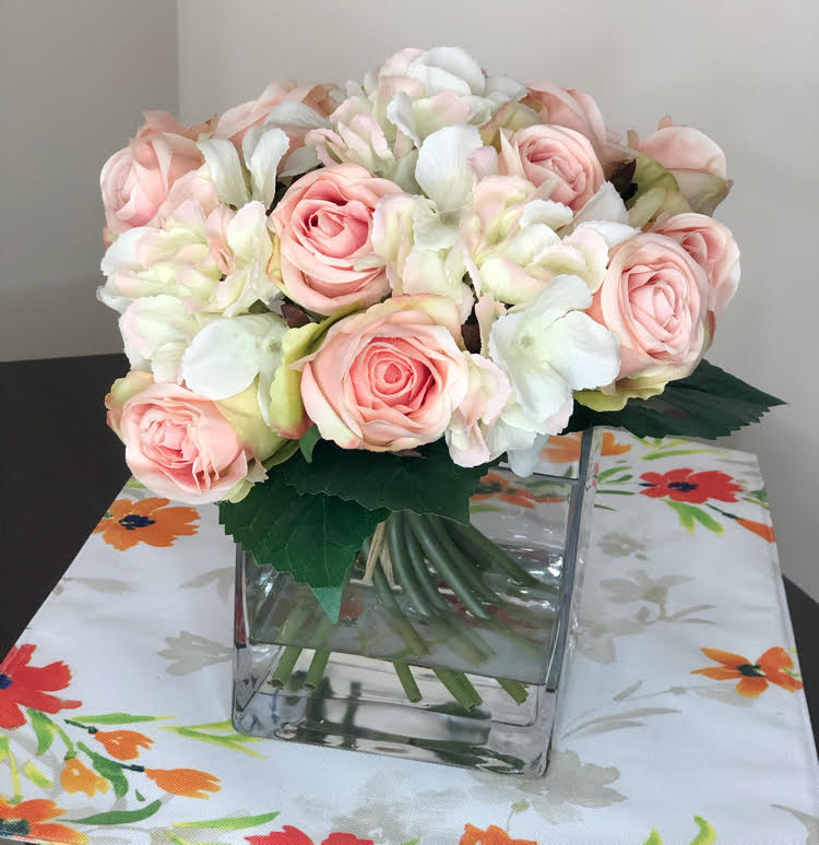 a photo of faux roses in a vase taken with my new TONOR selfie ring light