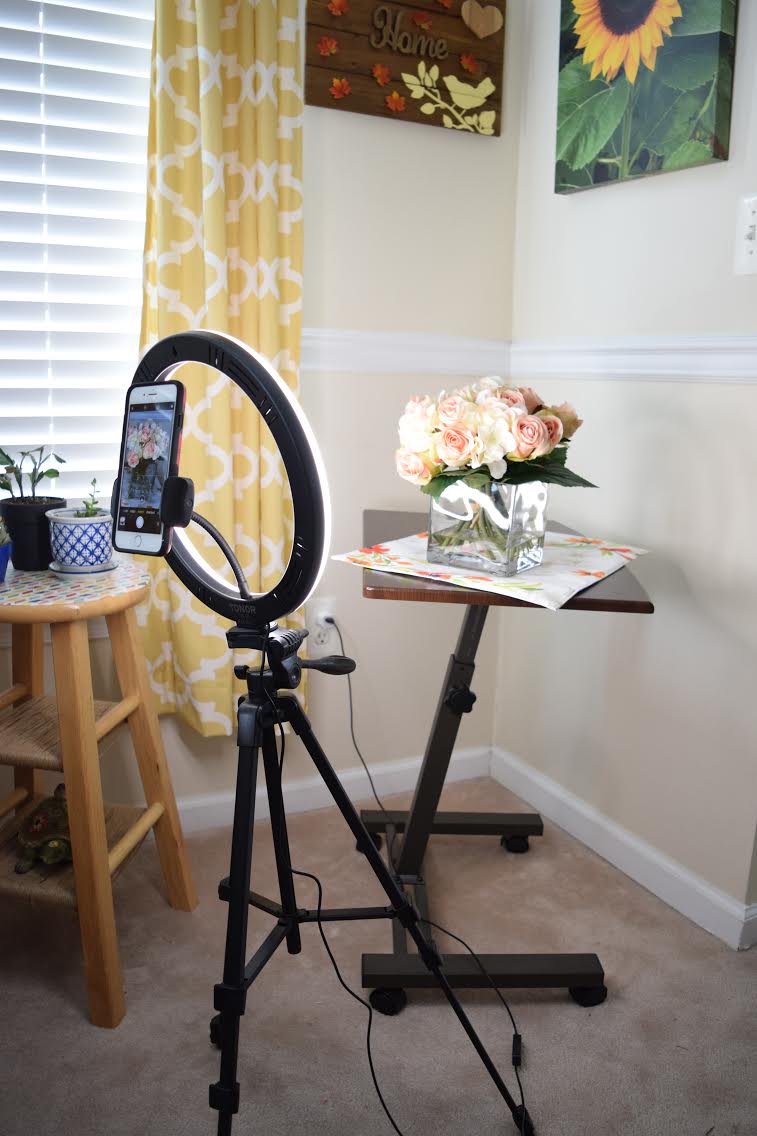 mini home photo studio setup with a portable smartphone ring light setup and a rolling tablle