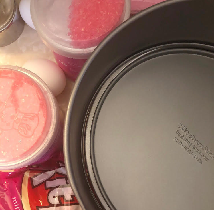 Ingredients for a pink KitKat double layer cake