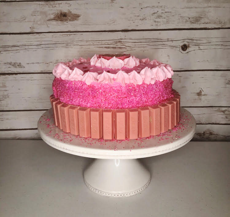 pink cake lined with raspberry creme KitKats