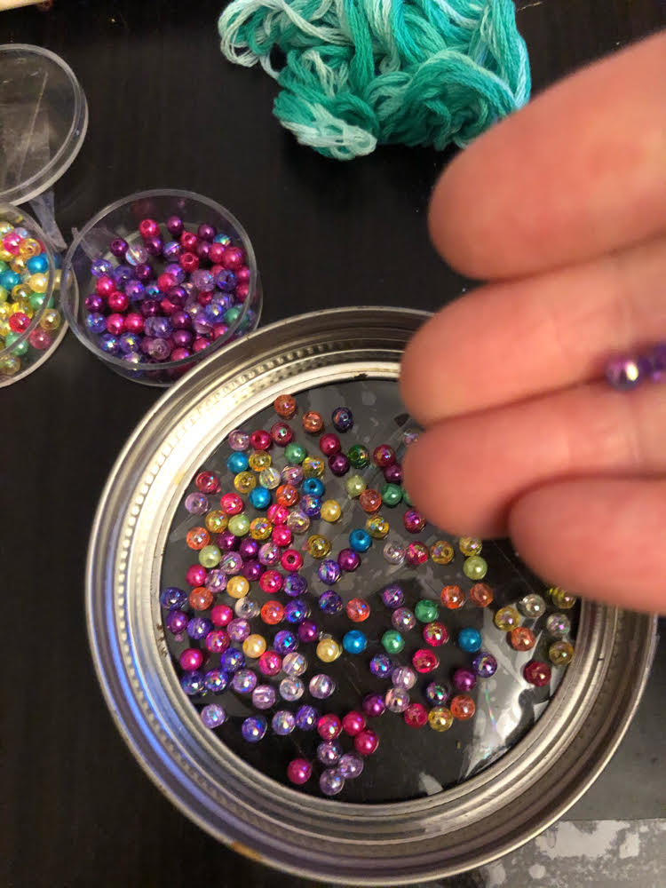 crafting a DIY suncatcher with beads, Duck tape and a mason jar ring