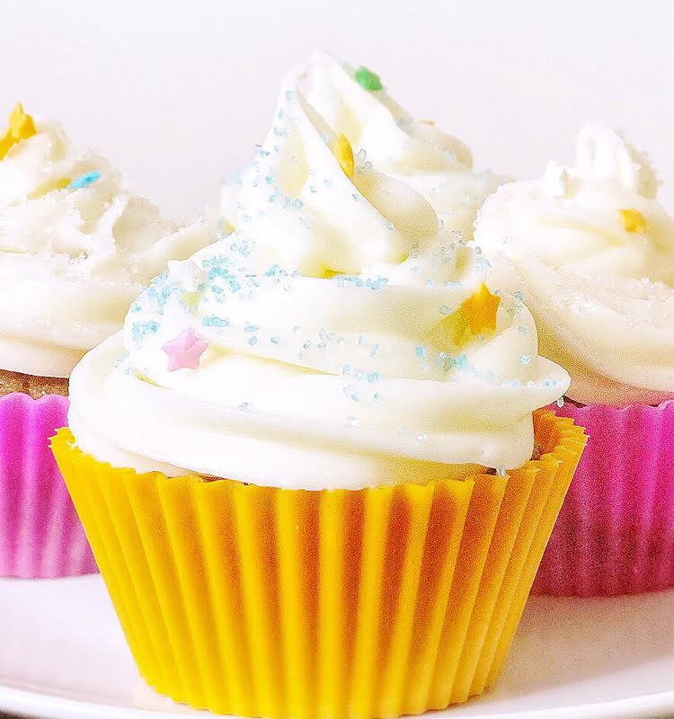 carrot cupcakes with cream cheese icing in pretty silicone reusable cupcake liners