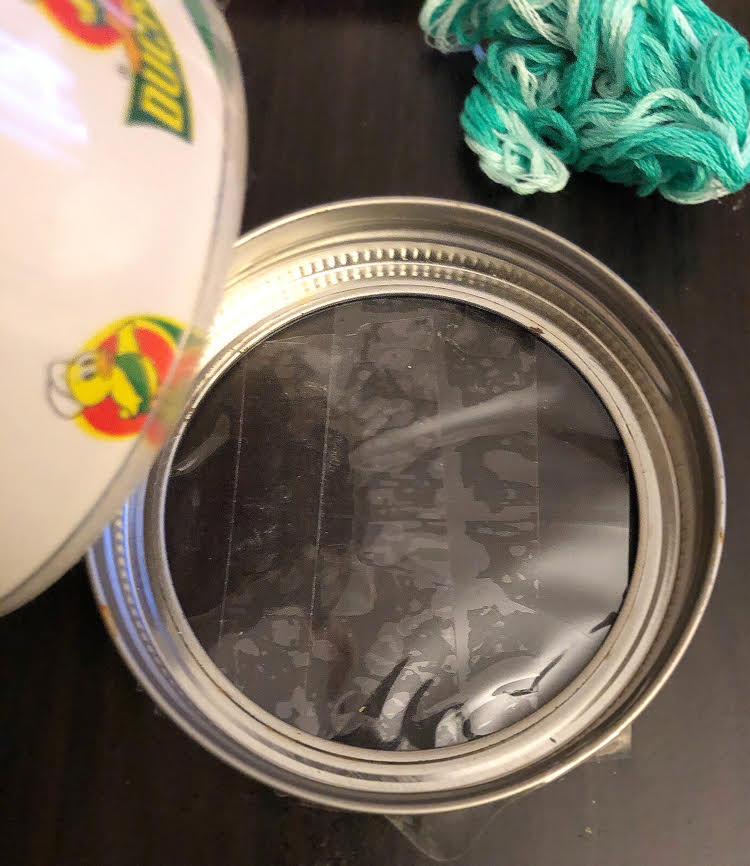 Making a DIY suncatcher with a mason jar ring and some Duck tape