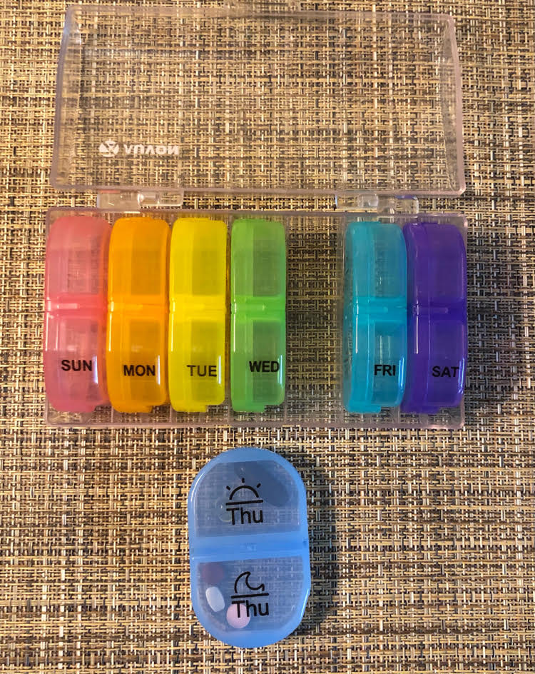 Colorful daily pill organizers