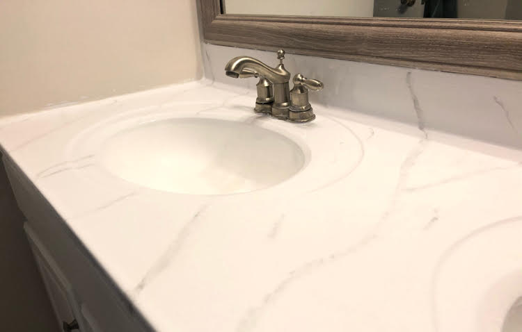 a bathroom counter painted with a Giani marble countertop kit