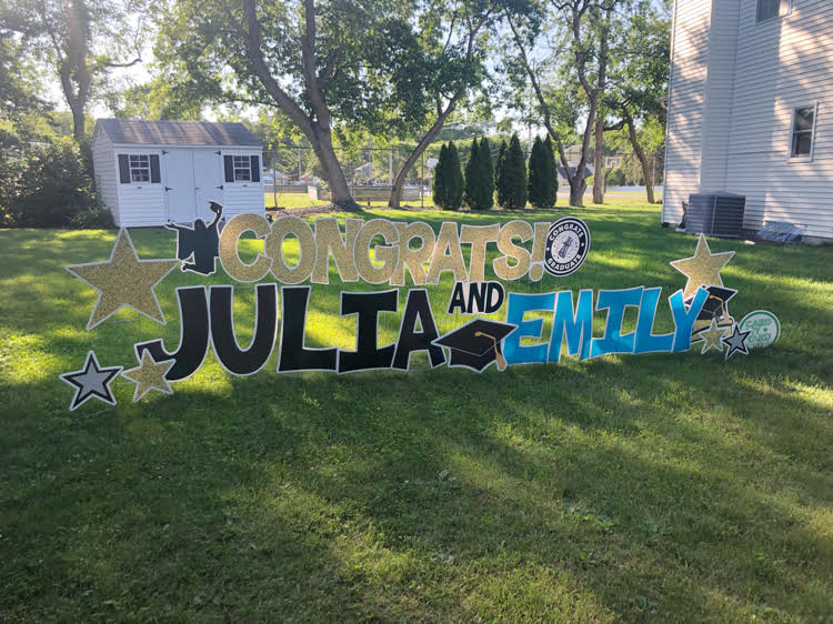 gold, black and blue graduation yard display by card my yard