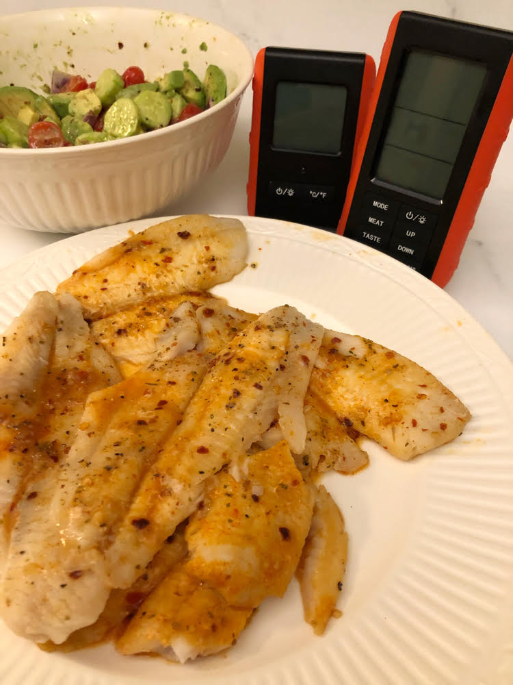 grilled fish, avocado salad, remote thermometer transmitter and receiver