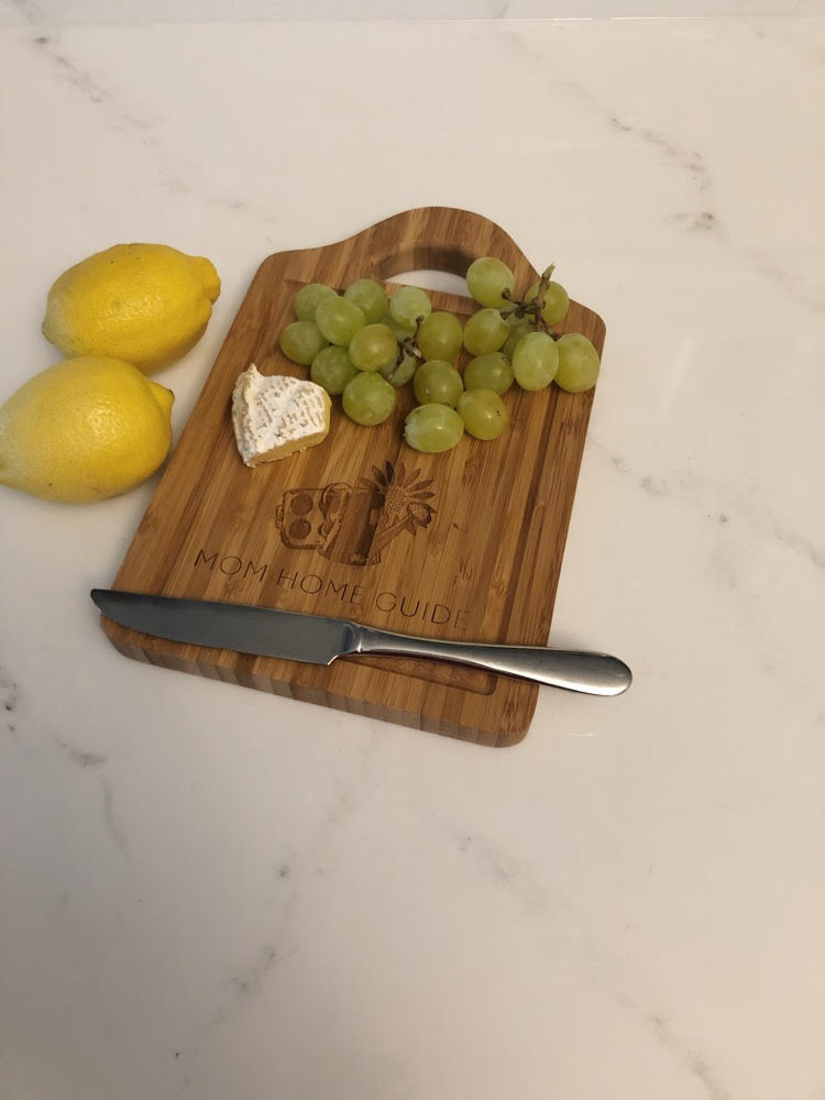 lemons, plus cutting board with brie and grapes on a cutting board