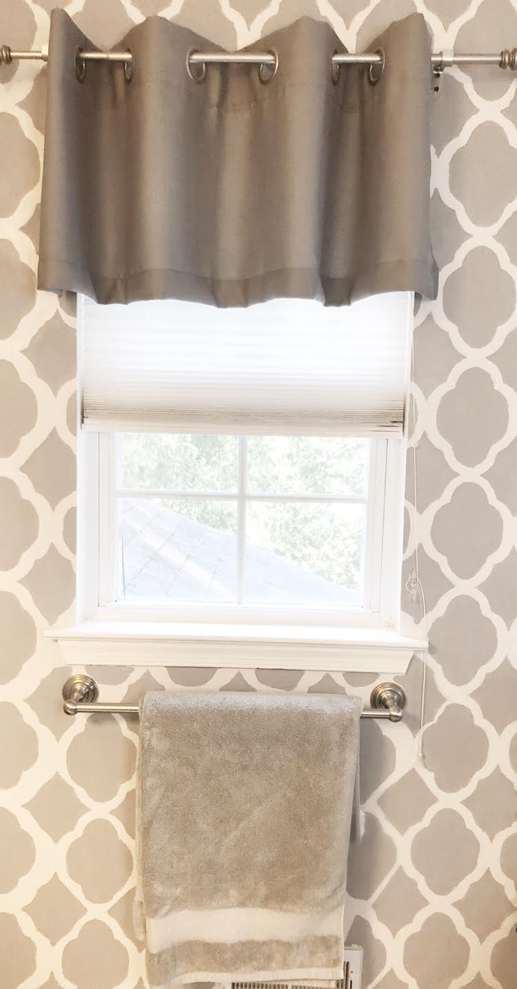 Luxury gray Therapedic bath sheet against a gray stenciled bathroom feature wall