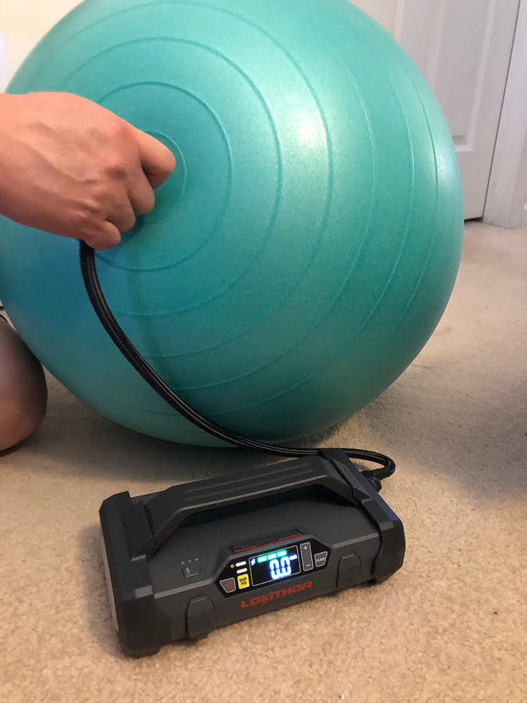 Inflating stability ball with Lokithor JA300 jump starter and air compressor.