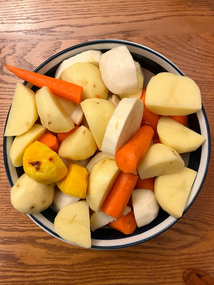 sliced raw root vegetables in a bowl