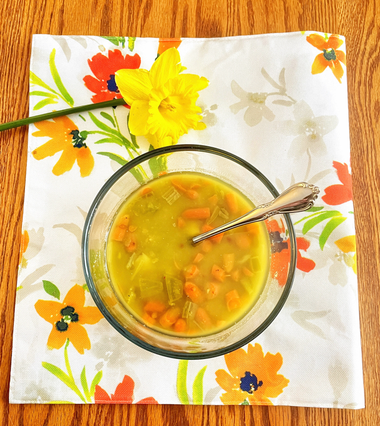 This pea soup is filled with veggies like carrots, celery and potatoes.