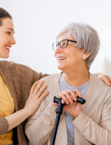 Daughter helping her senior mom